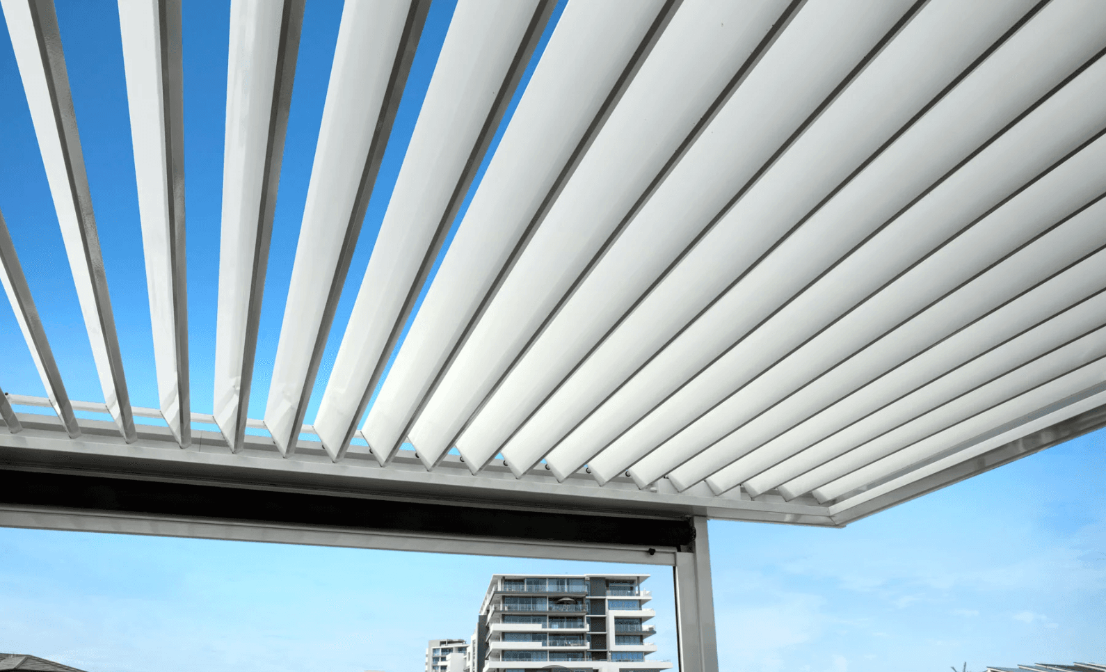 White louvres with city skyline view
