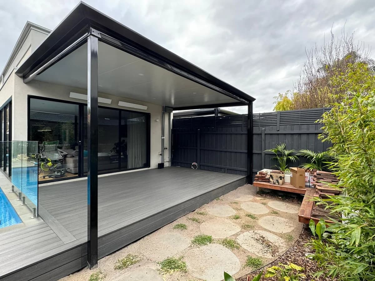 Monument gable verandah by pool with grey decking